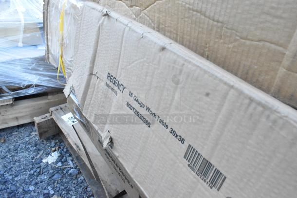 Cardboard packaging of Regency 16 Gauge Work Table 30x36, with visible dents, barcode, and model "600TSB3036S".