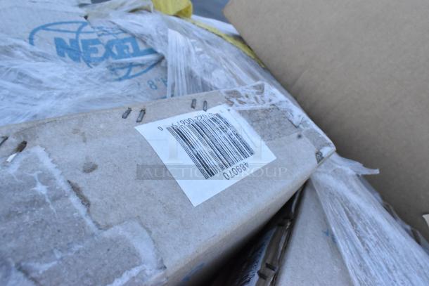 Cardboard boxes with barcode labels, containing scratch and dent items, including DH8 Quantum Storage Systems® document holders.