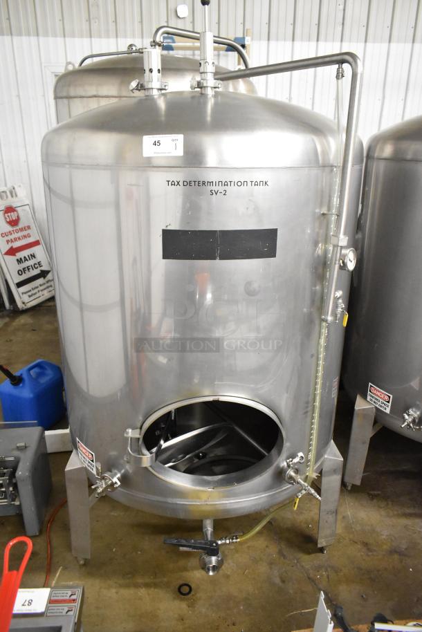 Stainless steel 8.75 BBL beer tax determination tank, 367-gallon capacity, floor style, with involved gauges and valves.