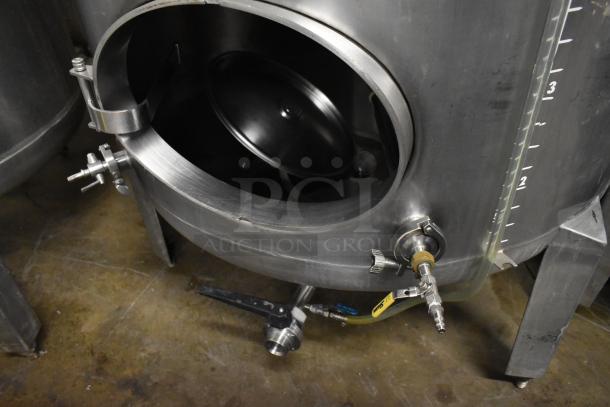 Stainless steel commercial beer tank, 8.75 BBL capacity, floor style. Features spigots and measurement markings.