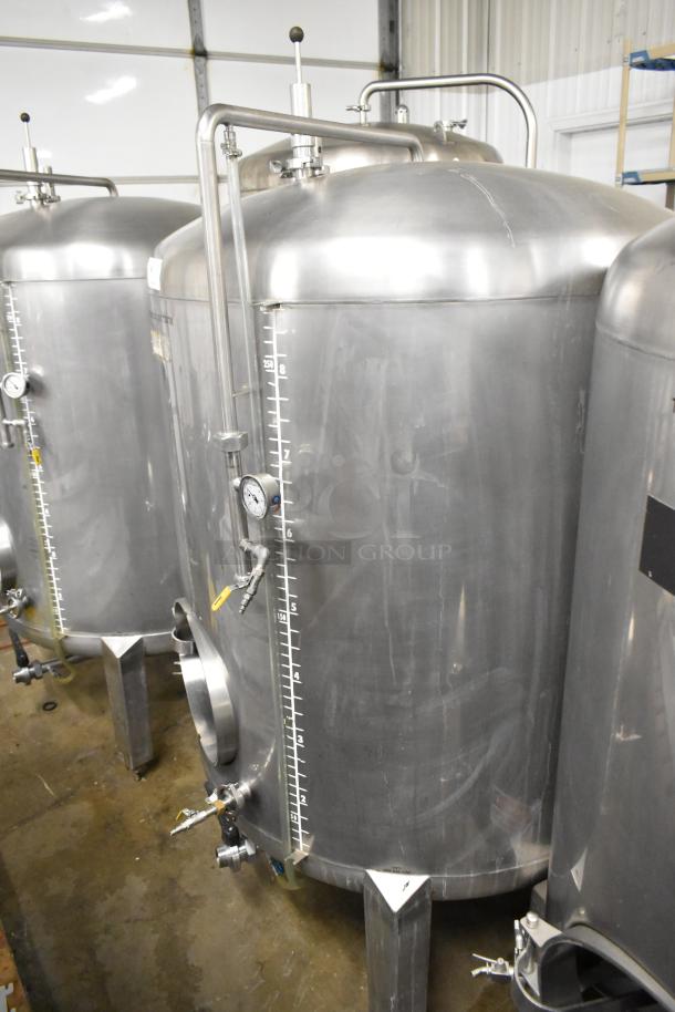 Stainless steel commercial 8.75 BBL, 367-gallon beer tank with measurement markings and gauges, in good condition.