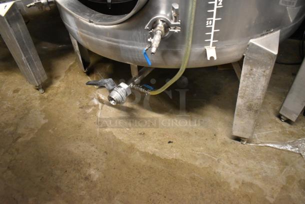 Stainless steel 8.75 BBL beer tank with spouts and measurement markings, in good condition.