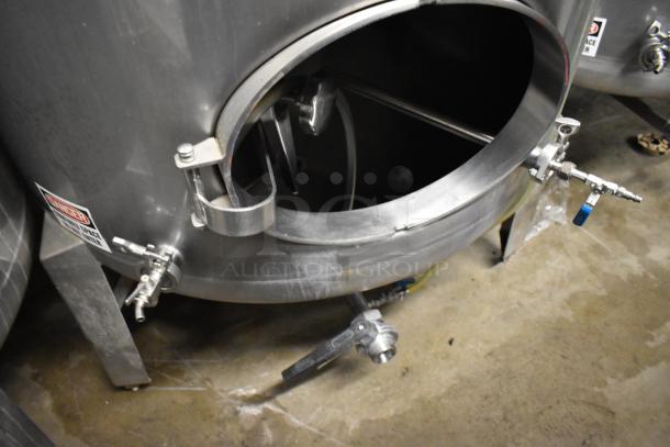 Stainless steel 8.75 BBL beer tax determination tank, floor style, with visible valves and access hatch.