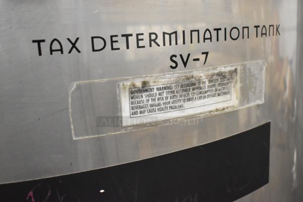 Stainless steel commercial 8.75 BBL beer tax determination tank, model SV-7, with warning label visible.