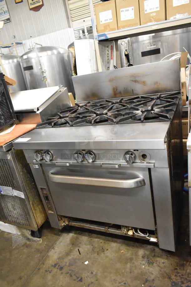 Southbend P36G-BBB stainless steel commercial 6-burner gas range with oven. Visible wear, suitable for professional kitchens.