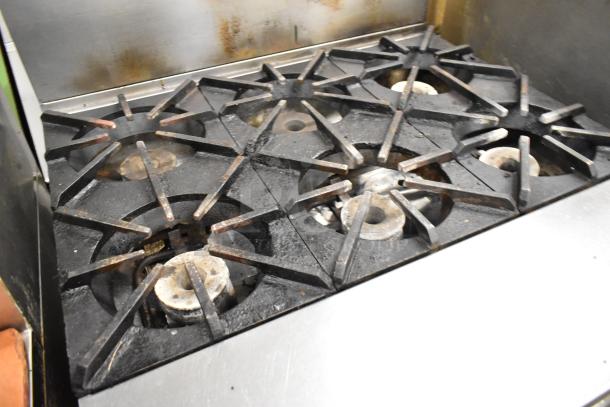 Southbend P36G-BBB stainless steel 6-burner range with oven, natural gas, signs of use, commercial-grade.