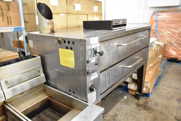 Bakers Pride 4151 stainless steel single deck pizza oven on legs, natural gas, 70,000 BTU, visible wear, commercial use.