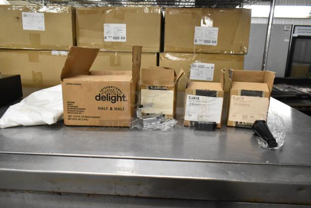 Five brand new Kason items, including door catch and door strike, in original boxes with visible product labels.