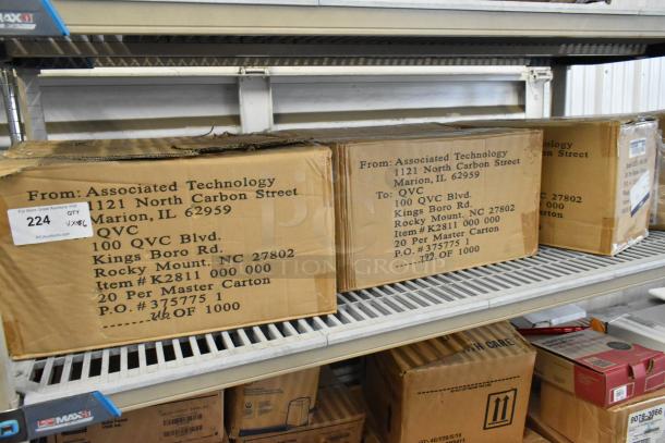 Six boxes on a shelf, including Betco Emulsinator Non Rinse Stripper. Box marked with K2811 000 000, 20 per master carton.