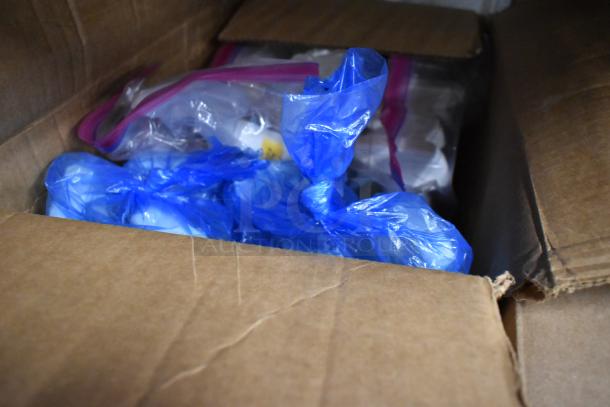 Cardboard box with various bottles including Clorox Anywhere Daily Disinfectant, wrapped in blue and clear bags, visible inside.