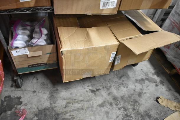 50 bottles of assorted cleaner, including Clorox Clean Up with Bleach, in cardboard boxes. Boxes are labeled and slightly worn.