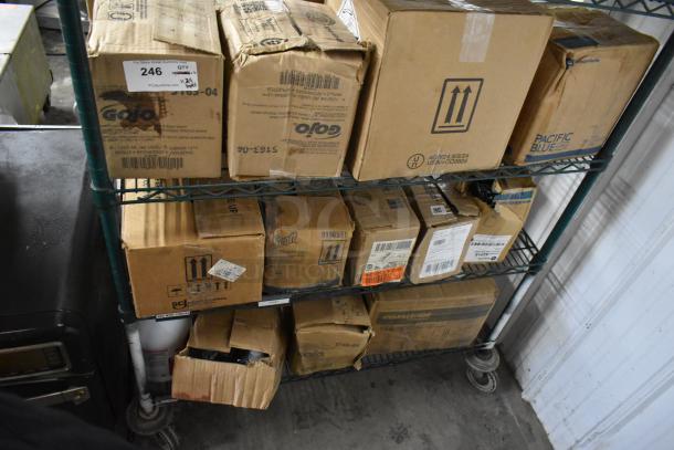 24 boxes of Gojo Green Hand Wash and Diversey Suma Detergent on metal rack; various conditions. Auction lot 246.