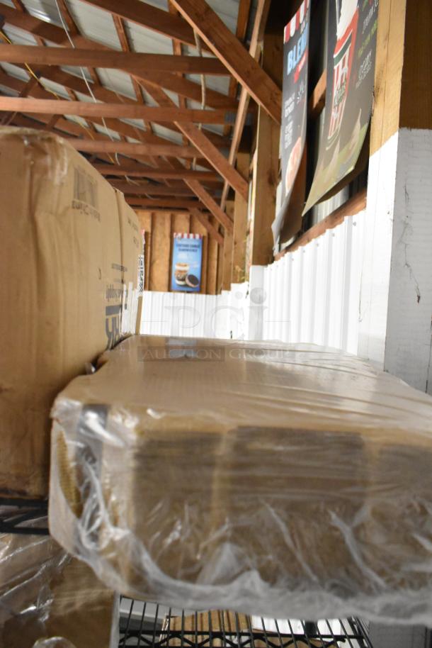 Seven sealed boxes on a metal shelf, including Provon Foaming Handwash and Diversey Grease Cleaner.