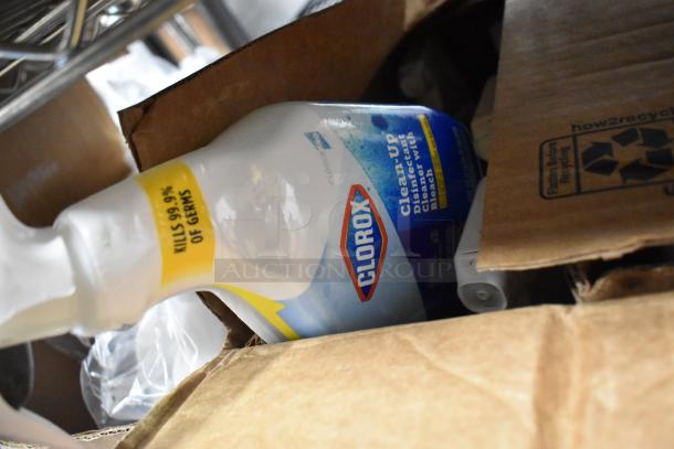 Clorox Clean-Up disinfectant spray bottle in a cardboard box, labeled "Kills 99.9% of germs," part of a 26-item lot.