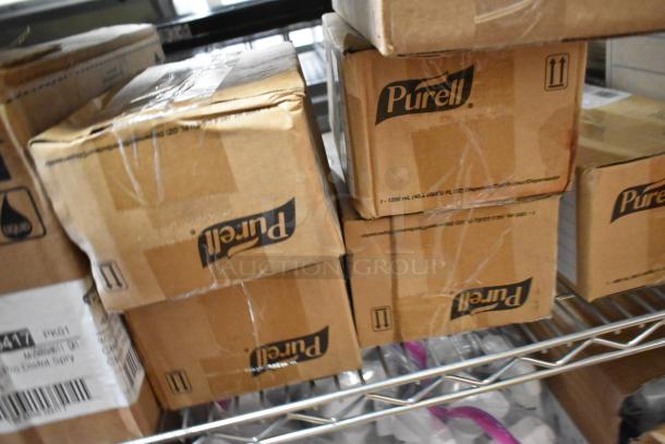 Cardboard boxes labeled "Purell" on a metal shelf, part of a 26-item lot including Clorox Disinfectant Spray.