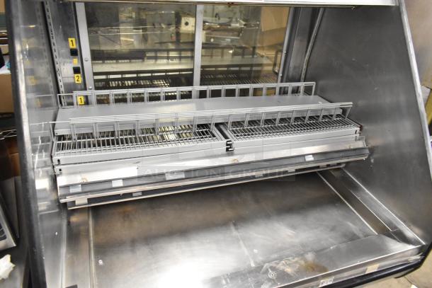 Metal Commercial Horizontal Grab N Go Merchandiser, stainless steel, adjustable shelves, slight wear, ideal for retail display.