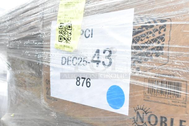 Pallet with boxed kitchen items, wrapped in plastic. Labels show "DEC25-43" and "876". Includes chef pants, knives.