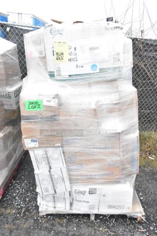 Pallet of 42 scratch and dent items, including towels, steam pan lids, and tumblers, wrapped in plastic. Various brand labels visible.