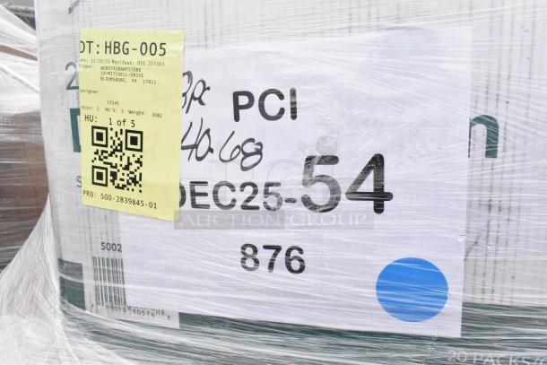 Pallet with scratch and dent items including towels and tumblers. Yellow label shows shipping info. Wrapped in plastic.