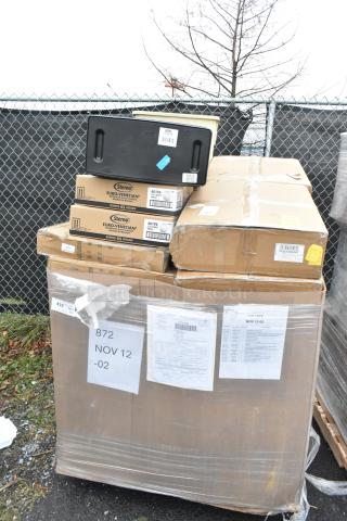 Pallet of 20 brand new scratch and dent items including Sterno storage box, syrup rack, and gloves, wrapped and labeled for auction.