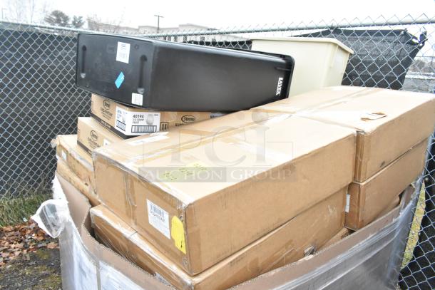 20 new scratch and dent items with storage box, gloves, syrup rack, and multiple sealed boxes, labels visible.