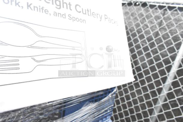 27 brand new scratch and dent items including bakery bread trays, teaspoons, and ramekin cups; box marked with cutlery illustration.