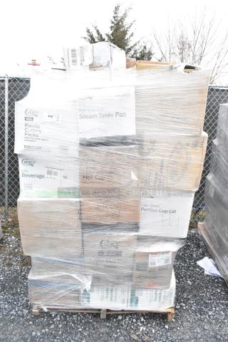 Pallet of assorted new items including paper towels, plastic plates, deli containers. Packaging intact, minor dents visible.