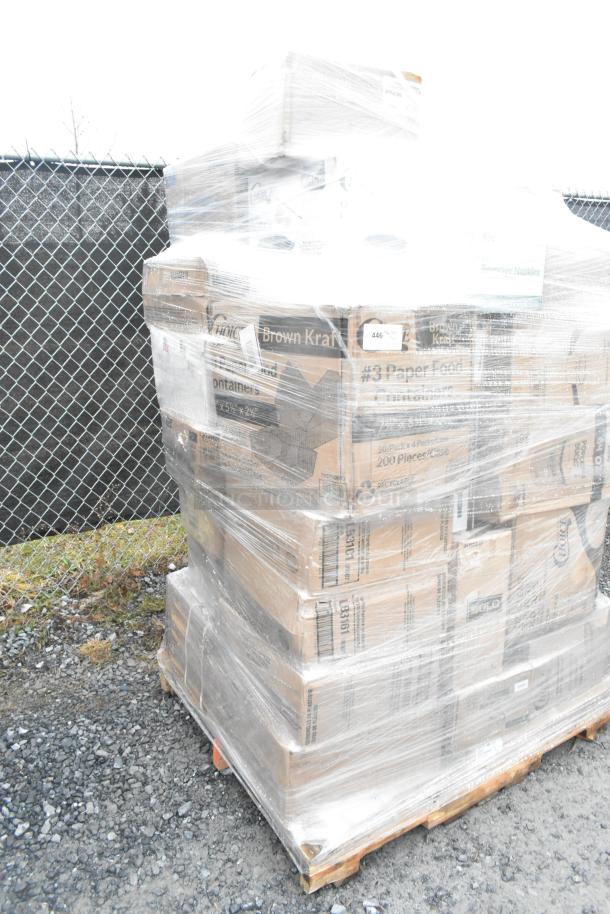 Pallet of mixed items including T-shirt bags, plastic tumblers, and paper towels, wrapped in plastic. Boxes labeled "Brown Kraft."
