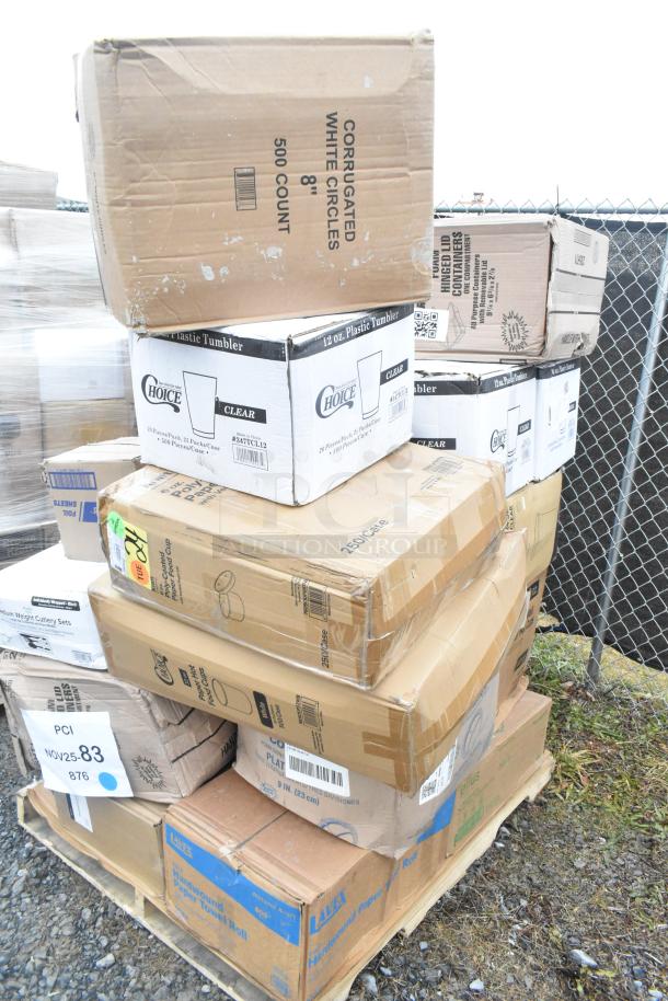 Boxes of scratch and dent items including food cups, cake circles, and cold cups stacked on a pallet. Mixed brands and labels visible.