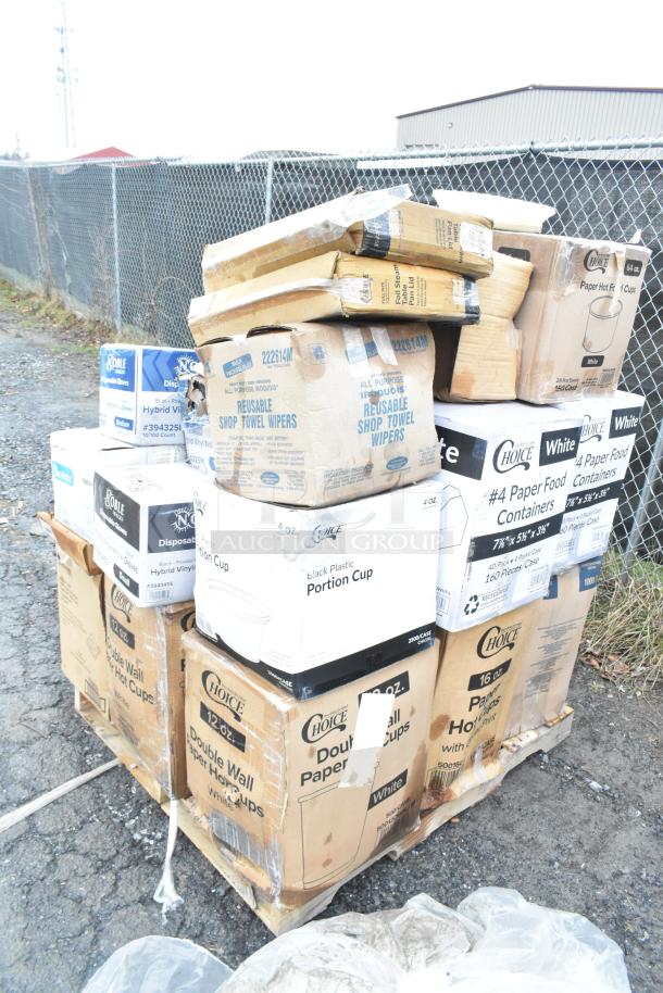 Pallet of assorted brand new dented items including towel wipes, paper cups, food containers, and gloves in boxes.