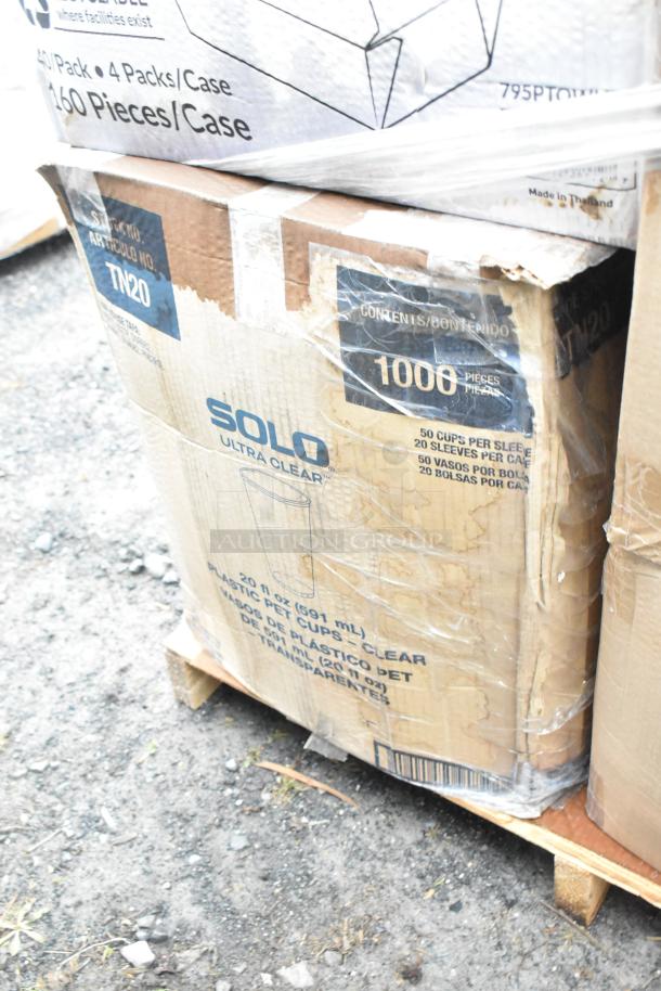 28-brand new scratch and dent items on pallets, including Solo Ultra Clear plastic cold cups, visible in boxes.
