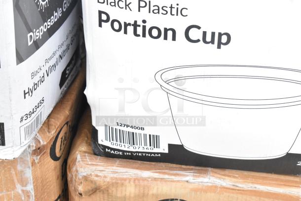 Boxes of black plastic portion cups and hybrid vinyl gloves. Labels show product details and barcodes. Made in Vietnam.