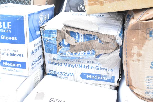 Damaged boxes of Noble NexGen Hybrid Vinyl/Nitrile Gloves, medium size, visible wear. Contains 28 assorted items including gloves and cups.
