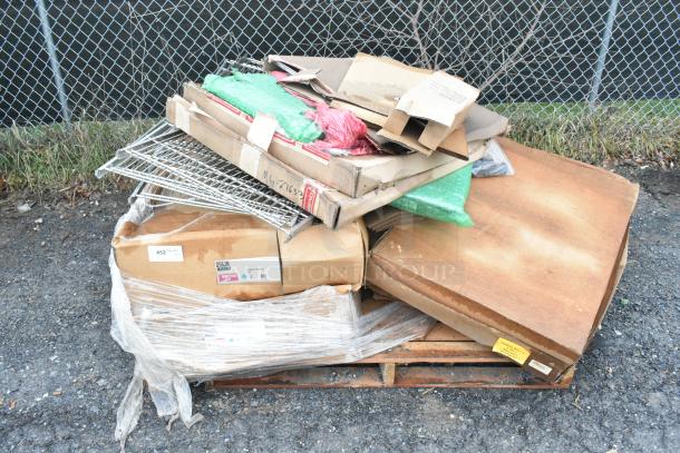 8 brand new scratch and dent items on a pallet, including Winco SPJH-906GN steam table pan and Metro D56JN truck dolly, boxed.