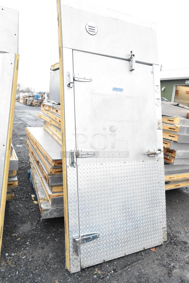 Two Penn walk-in cooler door panels, metal finish, without compressors, condensers, or evaporator fans, stacked outdoors.