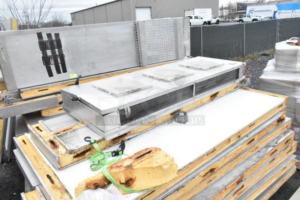 2 Penn walk-in freezer boxes, 10’x20’ combo, no compressors/condensers. Metal panels stacked, moderate wear visible.