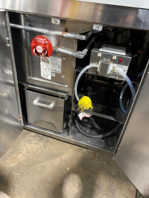 Commercial stainless steel popcorn popper machine, model 2973-137, with fire safety features and electrical components visible.