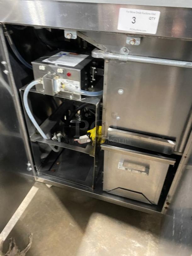 Gold Medal Model 2973-137 commercial popcorn popper interior, showing stainless steel construction and electrical components.