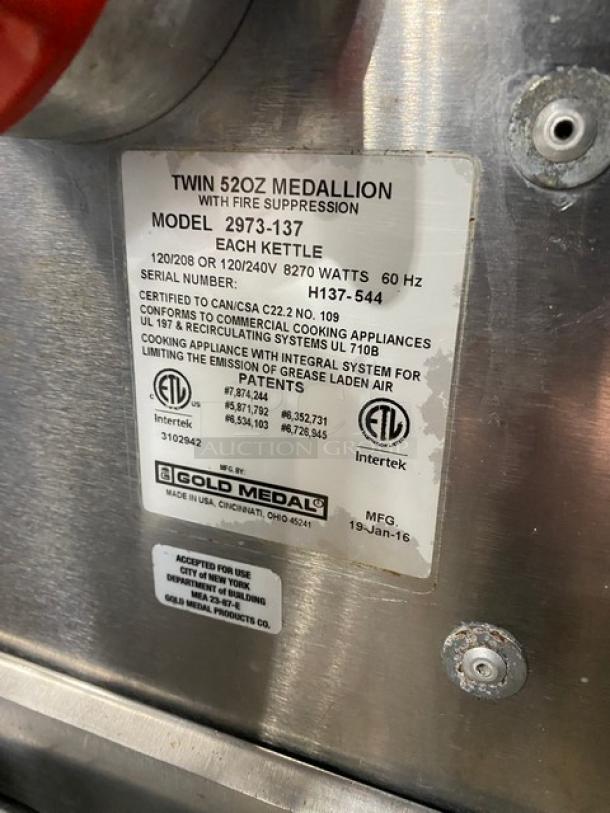 Gold Medal Model 2973-137 popcorn popper label. Features twin 52 oz. kettles, 120/208V or 120/240V. Serial H137-544.