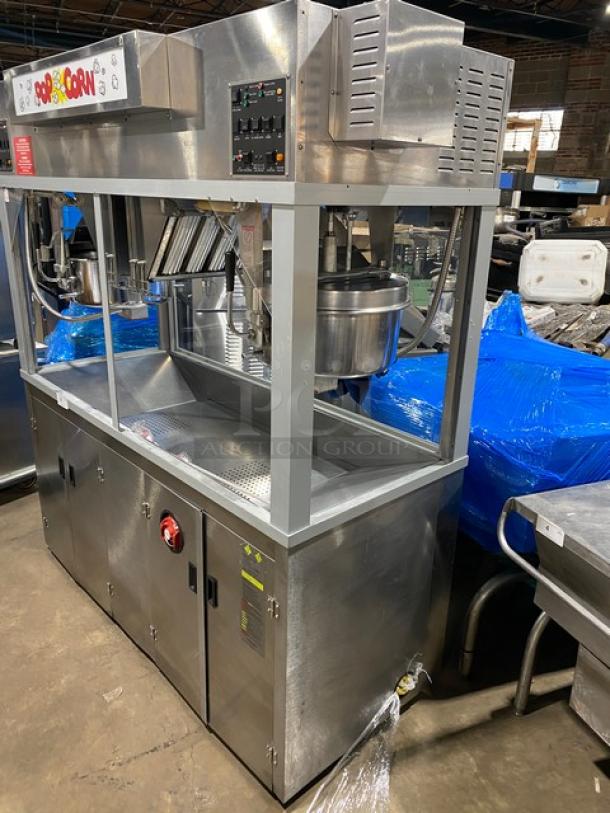 Commercial stainless steel Gold Medal popcorn popper, model 2973-137, with twin 52 oz. kettles and neon sign.