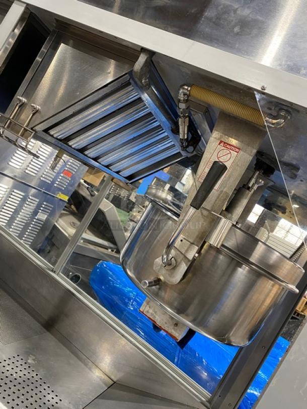 Commercial stainless steel popcorn popper machine, Gold Medal Model 2973-137, features twin 52 oz. kettles, neon popcorn sign, excellent condition.