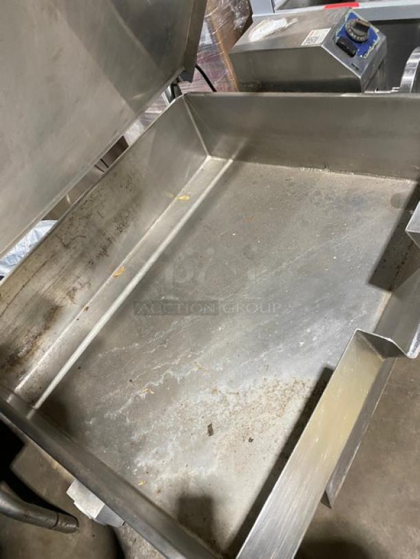 Cleveland Range stainless steel gas-powered tilted braising pan with Ultra Tilt skillet feature, shown on legs, used condition.