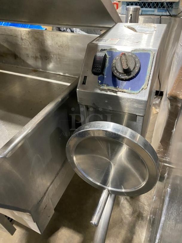 Cleveland Range stainless steel gas-powered tilted braising pan, features control knob, mounted on legs, good condition.