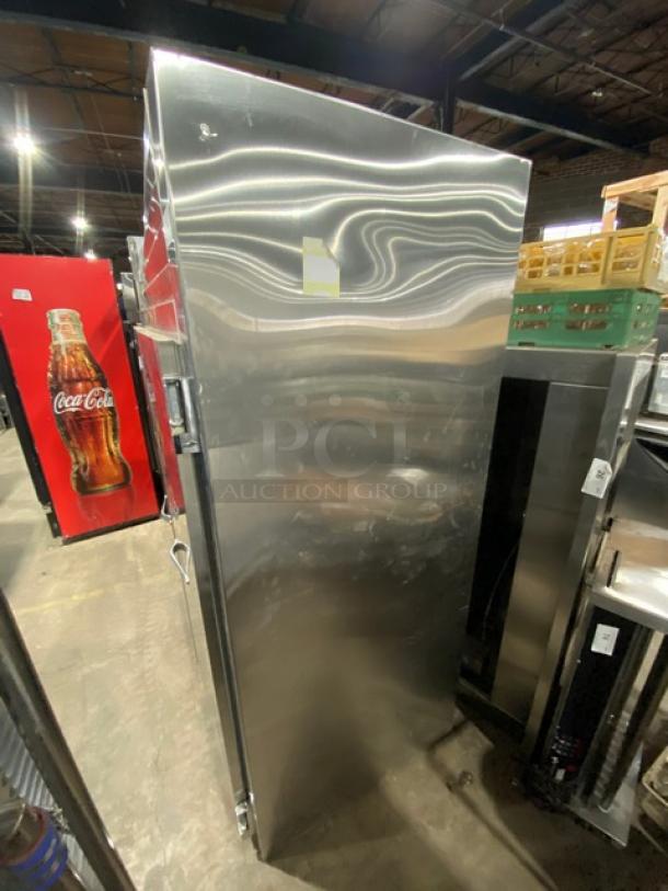 Traulsen stainless steel 2-door reach-in refrigerator, model RHT232WUT172, with chrome-plated rack, in good condition.