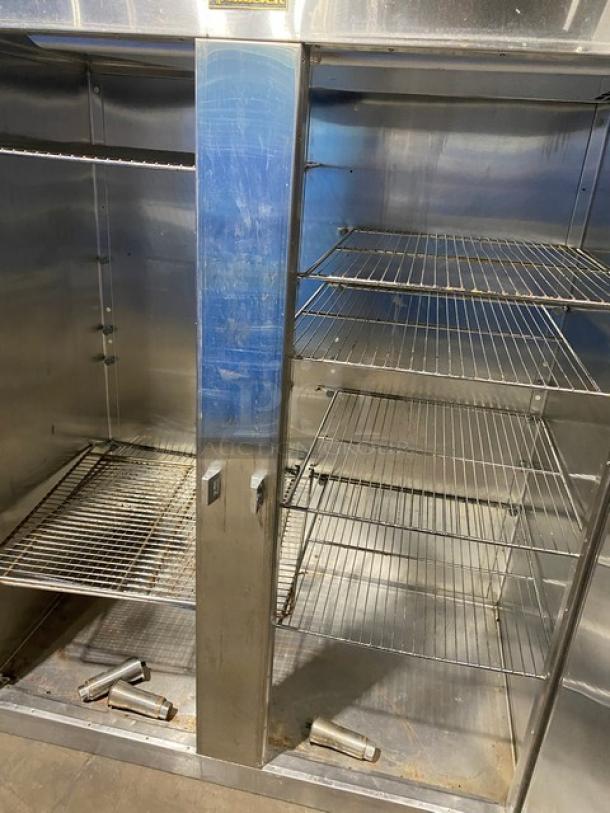 Traulsen stainless steel 2-door reach-in refrigerator, model RHT232WUT172, with chrome racks and visible wear.