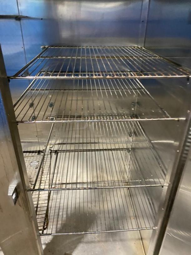 Traulsen RHT232WUT172 stainless steel 2-door reach-in refrigerator with chrome-plated wired racks, commercial use.