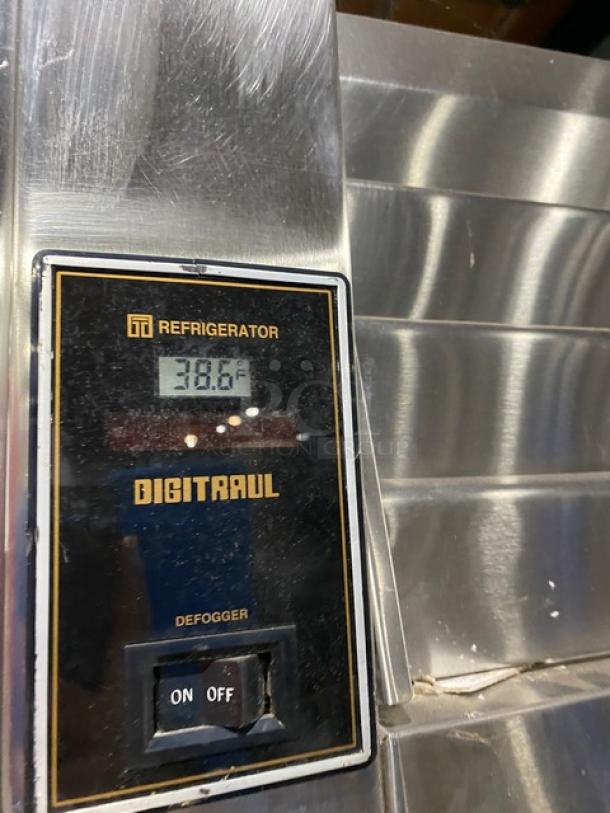 Traulsen RHT232WUT172 stainless steel refrigerator, digital display at 38.6°F, model and features visible, used condition.