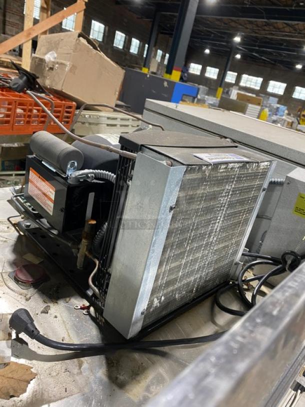 Traulsen RHT232WREHHS stainless steel refrigerator component, showing compressor and wiring, used condition. Model: RHT232WREHHS.