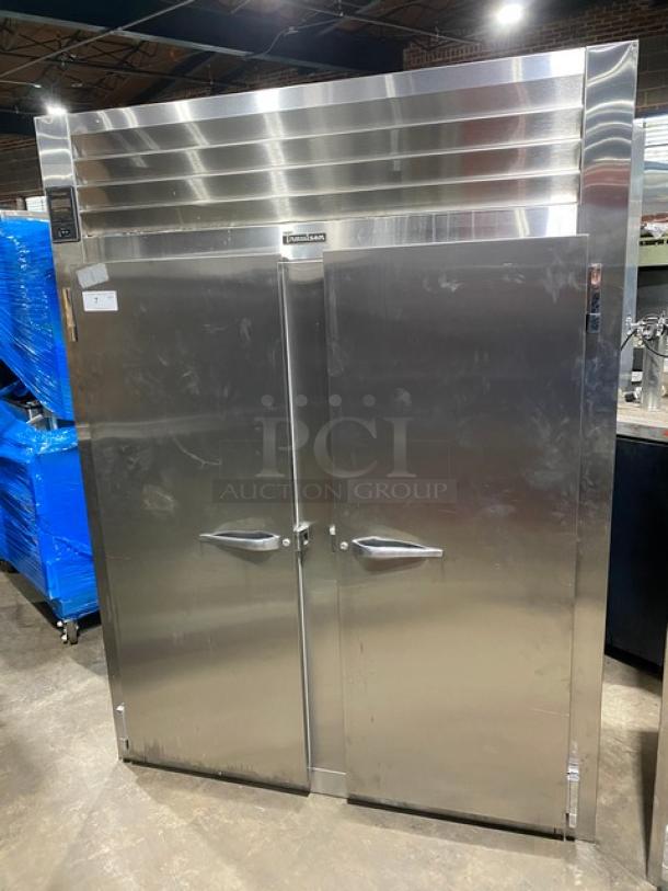 Traulsen stainless steel 2-door reach-in refrigerator, model 1RHT232WUT, with chrome plated rack, in good condition.