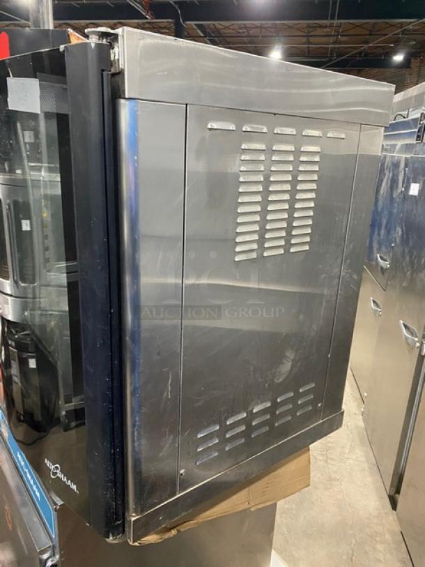 Alto-Shaam stainless steel electric countertop rotisserie oven with digital controls, visible vented side, used condition.